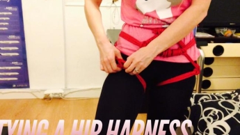 Untying a hip harness