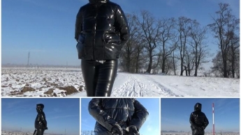 Winterspaziergang in einer PVC-Daunenjacke und Handschellen (Hände zurück)