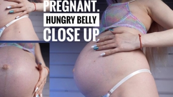 schwangerer Bauch ist hungrig. Necken & Nahaufnahme von sexy Blondine