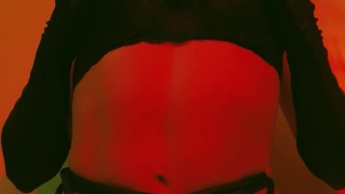Lust is dressed in outrageous red, a display of sensuality and domination.
